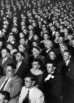 a crowd of people wearing 3d glasses