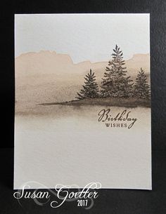 a card with watercolor trees on it