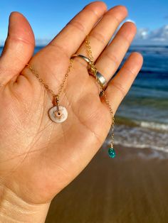 Kauai Puka Shell Necklace - Etsy Dainty Round Jewelry For Beach, Dainty Shell Jewelry For Beach, Dainty White Shell Necklace, Beach Shell Charm Necklace With Pearl, Bohemian Pearl Charm Necklaces For Beach, Adjustable Dainty Shell Jewelry, White Shell Necklace With Starfish Charm, Ocean-inspired, Beach Pearl Charm Necklaces With Shell, Beach Shell Charm Necklaces With Pearl