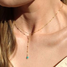 "Our lariat necklace is perfect minimalist jewelry. This dainty necklace is perfect with your favorite tee or your little black dress. A natural turquoise drop adorns a 14kt gold filled satellite chain.  D E T A I L S *Natural Arizona turquoise chips *2 inch drop  *Dainty satellite chain *100% 14kt gold dainty link chain  LENGTH *The standard length is normally 18\". *Model is wearing a 16\" in Photos. HOW TO PERSONALIZE *Select your choices from the drop down menu to create your custom design. ∙ EXTRA LOVE ∙ Handcrafted just for you in sunny Arizona by a team of talented women. All of our jewelry comes gift packaged! We are happy to leave a note if this is a special gift, just let us know in the message box at checkout. PRODUCTION ∙ TIMES All items are made to order. Please check the esti Dainty Lariat Necklace, Dainty Turquoise Necklace, Bohemian Lariat Necklace With Delicate Chain As Gift, Adjustable Bohemian Lariat Necklace With Delicate Chain, Dainty Lariat Jewelry With Adjustable Length, Adjustable Turquoise Elegant Lariat Necklace, Elegant Adjustable Lariat Turquoise Necklace, Elegant Adjustable Turquoise Lariat Necklace, Handmade Minimalist Lariat Necklace As Gift