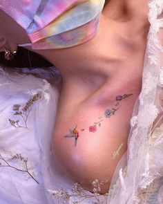 a woman's breast with flowers on it