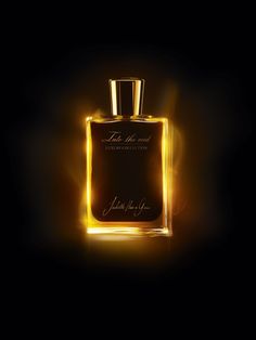 a bottle of perfume on a dark background with light coming from the top and bottom