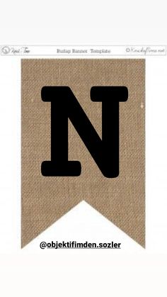 the letter n is made out of burlap paper and has black letters on it