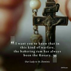 a person holding a rosary with a quote on it