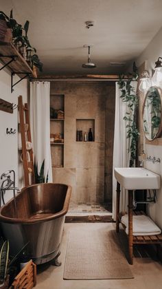 a bath tub sitting next to a sink in a bathroom