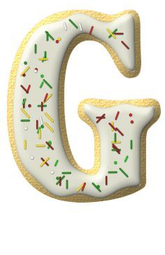 the letter g is decorated with sprinkles and frosting on it's sides