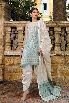 It is an eastern dress of women in our online store. The Pakistani salwar kameez images of women is in blue and cream colour combination. This attire's lawn shirt has printed sleeves, front and back. The embroidered neck on organza also looks beautiful. This Pakistani salwar kameez images of women is available in custom size. Duppatta: The blended zari and cotton weave dupatta is dyed. Bottom: The salwar of this dress is printed and made from the fabric of cotton. ADDITIONAL INFORMATION SKU: P27 Embroidered Suits, Zara Shahjahan, Eastern Dresses, Desi Dress, Kurti Style, Chiffon Party Dress, Pakistani Couture, Pakistani Salwar, Jacquard Shirt