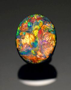 an opalite stone sitting on top of a table