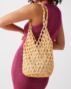 Chunky beads in an open lattice design give the FIJI bag a beachy vibe with a drawstring lining to keep all your valuables secure. Beaded shoulder bag Lined interior with drawstring closure Interior zipper pocket Open lattice beading 11.5in H x 7in W x 7in D Synthetic materials Duster bag included Imported Beaded Crochet Rectangular Bag For Beach, Bohemian Pouch Bucket Bag For The Beach, Bohemian Beach Bucket Bag Pouch, Beaded Beach Bags For Beach Season, Bohemian Beach Bucket Bag In Pouch Shape, Beaded Natural Color Beach Bag, Bohemian Beach Bucket Bag, Summer Vacation Beaded Shoulder Bag, Rectangular Beaded Beach Bag