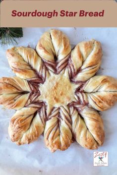 a star shaped pastry with the words sourdough star bread