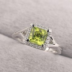 ◆ The ring is handcrafted from sterling silver and decorated with a dazzling 6*6 mm peridot and CZs. It is suitable for engagement/anniversary/daily occasion. ◆ Production Description: Main stone Type: Natural Peridot Main Stone Shape: Princess Cut Main Stone Size: 6*6 mm(1.3ct) Side stone: CZ Metal: 925 Sterling silver - Other options available in the drop down menu ◆ Customization: √Free for Add Engraving √Other Metal Type Available √Other Gemstones & Shapes Available √Personalization Requests Peridot Rings, Ring Princess Cut, Peridot Engagement Rings, August Birthstone Ring, Mothers Ring, Mother Rings, Silver Anniversary, Princess Cut Rings, August Birthstone