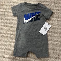 Nike Onesie Size: 9m Brand New With Tags Nike Romper, Nike Onesie, Buckeye Baby, Baby Nike, Toddler Nikes, Grey Bodysuit, Ruffle Bodysuit, Nike Zip Up, Newborn Sets