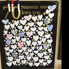 a black and white sign with lots of hearts on it that says 70 reasones we love you