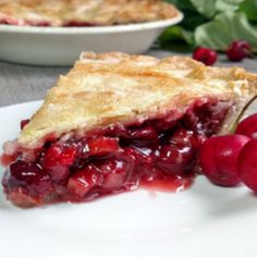 a slice of cherry vanilla rhubar pie on a plate