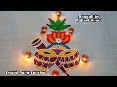 an artistic decoration with candles and lights on a wooden surface for diwaling the festival