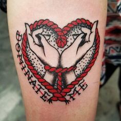 a tattoo with two hands in the shape of a heart