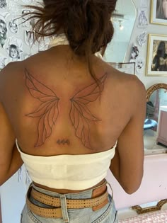 a woman with a tattoo on her back