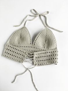 two crocheted bras with ties tied around them