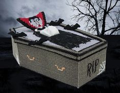 a knitted box with a pirate hat on top