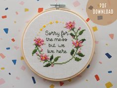 a cross stitch pattern with the words sorry for the mess but we're here