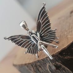 This stunning Sterling Silver Pendant is a must have for any fairy lover!  The term fairy is used to describe a type of legendary mythical being of romance or folklore. They are often smaller in size and are said to protect us from negative energies and help us with spiritual guidance!. - Over 10 grams of Sterling Silver (925) - 5 cm (top off bale to bottom of pendant) - 925 Sterling Silver - The pendant comes with a PU adjustable black cord and in a gift bag.  Ready to be gift. - Statement piec Fairy Charms, Silver Wings, Fairy Princesses, Gift Necklace, Sterling Silver Pendants, Statement Necklace, Jewelry Necklace Pendant, 925 Sterling Silver, Jewelry Necklaces