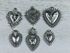 Listing is for 2 charms of chosen design made of a metal alloy with an antique silver finish great for bracelets and necklaces textured ornate design throughout 1mm hole on 4 of the charms...1.5mm hole on evil eye and large crown heart also available in store in a patina/oxidized finish 1 thorugh 6 starting from the left top row Silver Heart Metal Charms, Silver Metal Charms For Valentine's Day, Nickel Free Silver Heart Charms, Nickel-free Silver Heart Charms, Nickel-free Heart Silver Charms, Silver Heart Charms For Jewelry Making, Handmade Silver Heart Charms, Large Crown, Love Spiritual