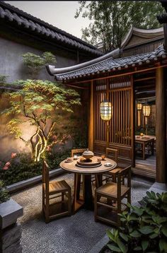 an outdoor dining area with wooden tables and chairs