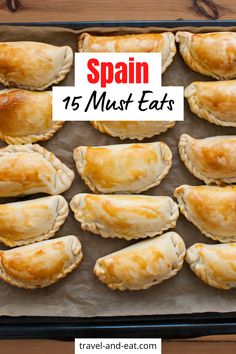 some food is sitting on top of a baking sheet with the words spain 15 must eats