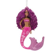 a pink and purple mermaid ornament hanging from a string on a white background