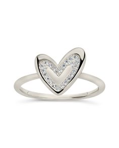 Our Mabel CZ Heart Ring is the perfect accessory for showing your heart some love. This sterling silver ring dazzles with the sweetest little heart, making it an ideal gift for showing someone special how much you care. Go on, show yourself some love — you deserve it! Materials: 14K gold plated sterling silver or sterling silver, cubic zirconia Features: 1.5mm band, 0.4" heart, 1mm CZ stones, Lead & Nickel free Dainty Heart-shaped White Gold Diamond Ring, White Gold Ring With Heart Charm For Valentine's Day, Heart-shaped White Diamond Ring For Gift, Silver Diamond Promise Ring For Valentine's Day, Heart Shaped White Diamond Ring Gift, Heart-shaped White Diamond Ring Gift, Heart Shaped White Gold Promise Ring, White Gold Heart-shaped Promise Diamond Ring, Valentine's Day Gift Diamond Ring In Silver