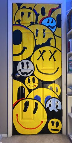 a door decorated with many smiley faces