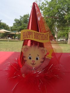 a birthday hat with a teddy bear on it