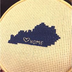 a cross - stitch pattern with the shape of rhode on it's blue and white background