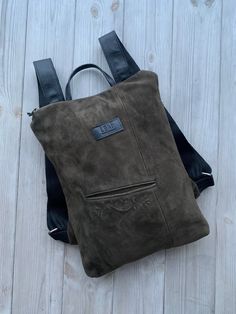 "Natural green suede leather backpack made from upcycled leather. One of a kind and could be very special Christmas gift. Minimalist design leather backpack fits 13\" laptop. Size 28x35 cm / 11x14 inch |SHIPPING: ready to ship in 1-2 days. |Custom orders: available under request. If you have any questions or special requests, please drop us a message. We are happy to help. For more - jump in here: www.etsy.com/shop/LFantasy Any written or visual information in this page can be used only with a w Green Soft Leather Backpack For Everyday, Green Leather Rectangular Backpack, Green Soft Leather Backpack, Green Leather Backpack For Everyday Use, Green Leather Backpack For Daily Use, Green Leather Backpack With Leather Handles, Visual Information, Backpack Fits, Laptop Size