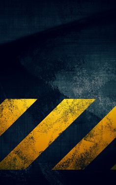 a yellow and black hazard sign on the side of a building with grungy paint