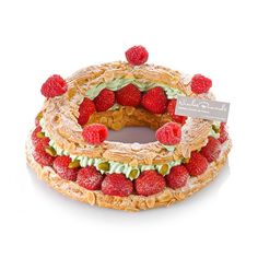 a cake with strawberries and other toppings on it