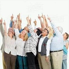 a group of people raising their hands in the air