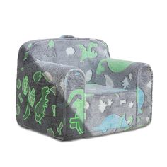 a gray and green chair with dinosaurs on it