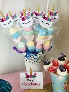 there is a cup full of candy with unicorns on it