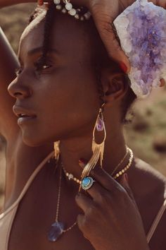 Our most popular crystal fringe statement earrings now come with Amethyst crystals. These unique tassel earrings look stunning when the light dances off of them! They are the perfect bridal or bridesmaids earrings or would make a great gift for yourself or a girlfriend. Amethyst is a stone of intuition, connecting you to your inner wisdom, empowering you to trust yourself! Amethyst crystals *color of purple amethyst is lighter purple and ranges in lightness Gold fringe earrings Weight: .22 oz Dr