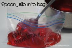 spoon jello into bag with red jelly in it and the words cell phone written on them