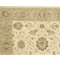 a beige rug with flowers and birds on it