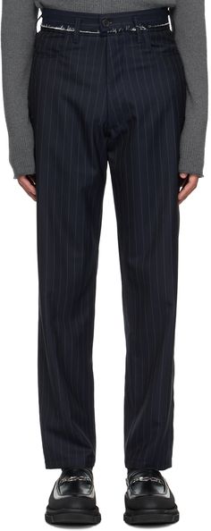 Relaxed-fit wool twill trousers. Pinstripes throughout. · Distressing and belt loops at waistband · Three-pocket styling · Zip-fly · Pleats at front · Partial plain-woven cotton lining Supplier color: Navy pinstripe Business Striped Pants With Belt Loops, Tailored Striped Bottoms With Belt Loops, Pinstripe Trousers, Twill Trousers, Woven Cotton, Luxury Streetwear, Cotton Weaving, Apparel Accessories, Trousers