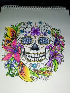 a drawing of a skull with flowers on it