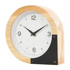 a wooden clock with black and white numbers on the face is shown in front of a white background