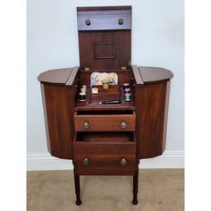 an old fashioned wooden desk with drawers