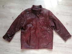 "Vintage 80s mahogany red Leather autumn coat, large jacket. Swedish Masens scandinavian motorcycles hipster, punk, goth clothes. Large sleeves. Unisex, women`s real leather jacket. Frontal buttons and zipper. 2 sides pockets. 1 inside slip pocket. Short sides belts with rivets (2 various sizes can make). Punk style, hipster. Made in Sweden. Dry leather cleaning only! brand: Masens Shinnindustri material of outer: genuine leather. Textile lining. condition: the jacket is in good condition. A lit Retro Burgundy Long Sleeve Outerwear, Vintage Burgundy Outerwear For Fall, Burgundy Leather Jacket Outfit, Leather Jacket Trench Coat, Burgundy Leather Jacket, Goth Clothes, Autumn Coat, Large Jacket, Sleeves Women