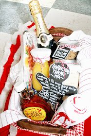 a basket filled with condiments and food on top of a checkered table cloth