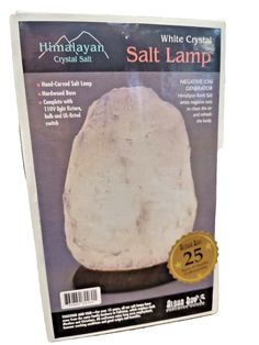 the himalayan crystal salt lamp is packaged in a white package with gold seal on it