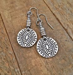 "Geometric, boho small silver dangle earrings with tribal etched pattern. Small, light weight boho, tribal inspired silver dangle earrings. Perfect for everyday wear and will add a little boho, southwestern vibe to your favorite outfit. Product overview: - Made with silver plated pewter drops and antiqued silver accents - Total hanging length of 1.75\" - Light weight and versatile, perfect for everyday wear - Hypoallergenic ear wiresPlease sign up for the Rustica Jewelry newsletter to receive sp Bohemian Sterling Silver Earrings With Oxidized Finish, Antique Silver Bohemian Earrings, Bohemian Etched Teardrop Jewelry, Metal Dangle Jewelry With Etched Details, Bohemian Stamped Jewelry For Jewelry Making, Etched Metal Dangle Jewelry, Adjustable Silver Bohemian Earrings, Bohemian Silver Etched Earrings, Silver Etched Bohemian Earrings